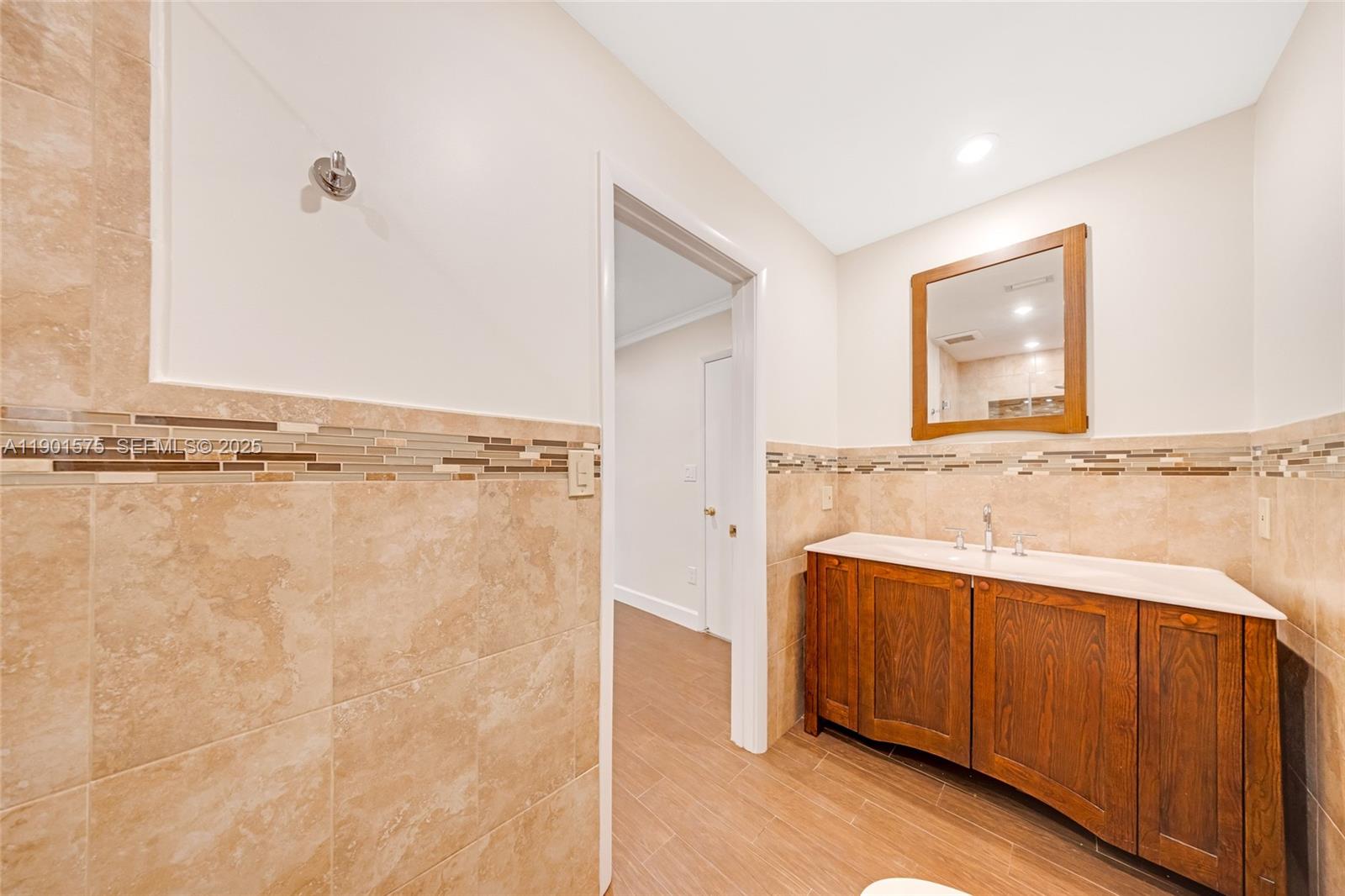 10501 Southwest 126th Avenue Miami, FL 33186 - Photo 23 of 42 a bathroom with a sink and mirror