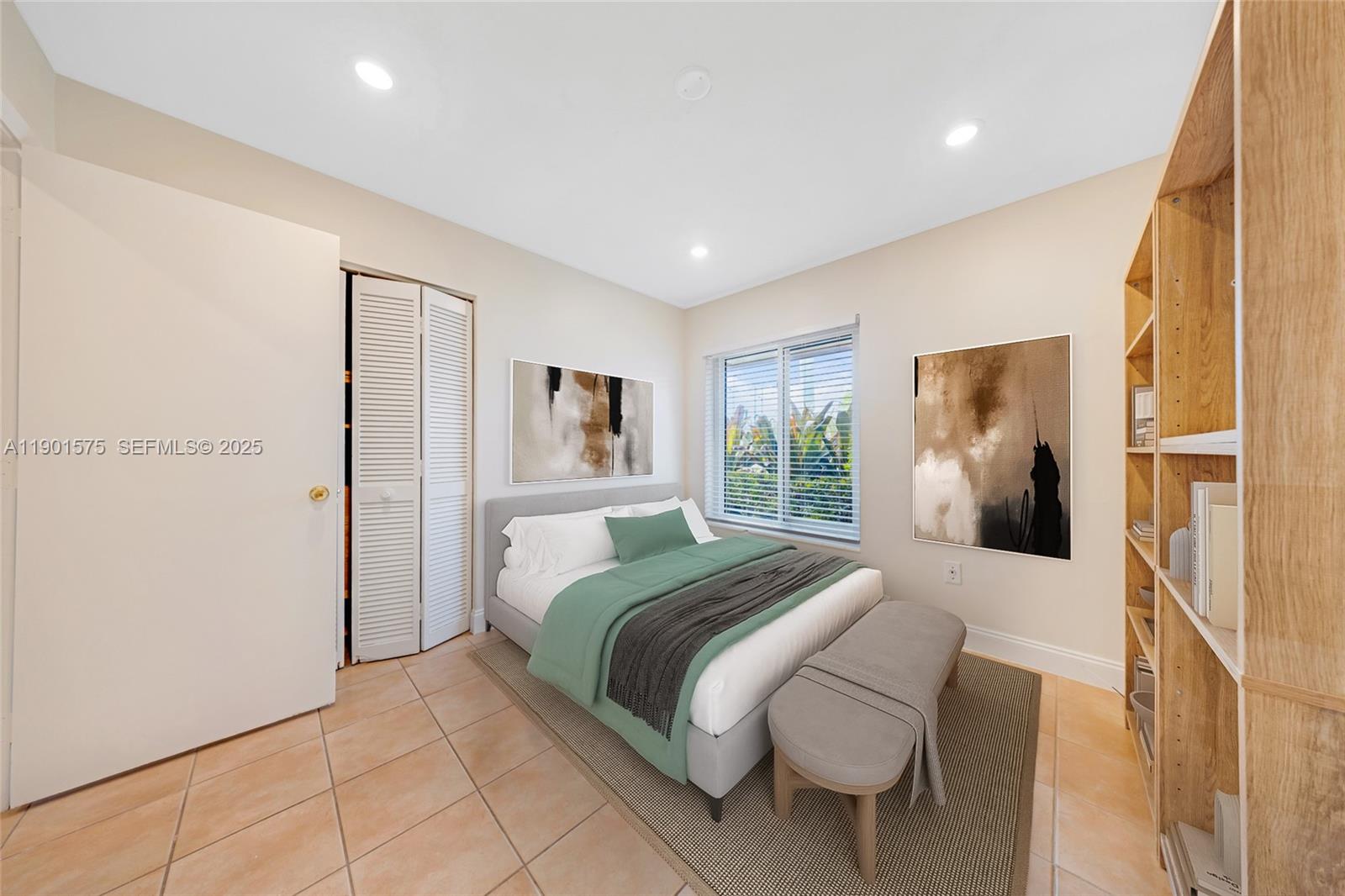 10501 Southwest 126th Avenue Miami, FL 33186 - Photo 26 of 42 a bedroom with a large bed and a window