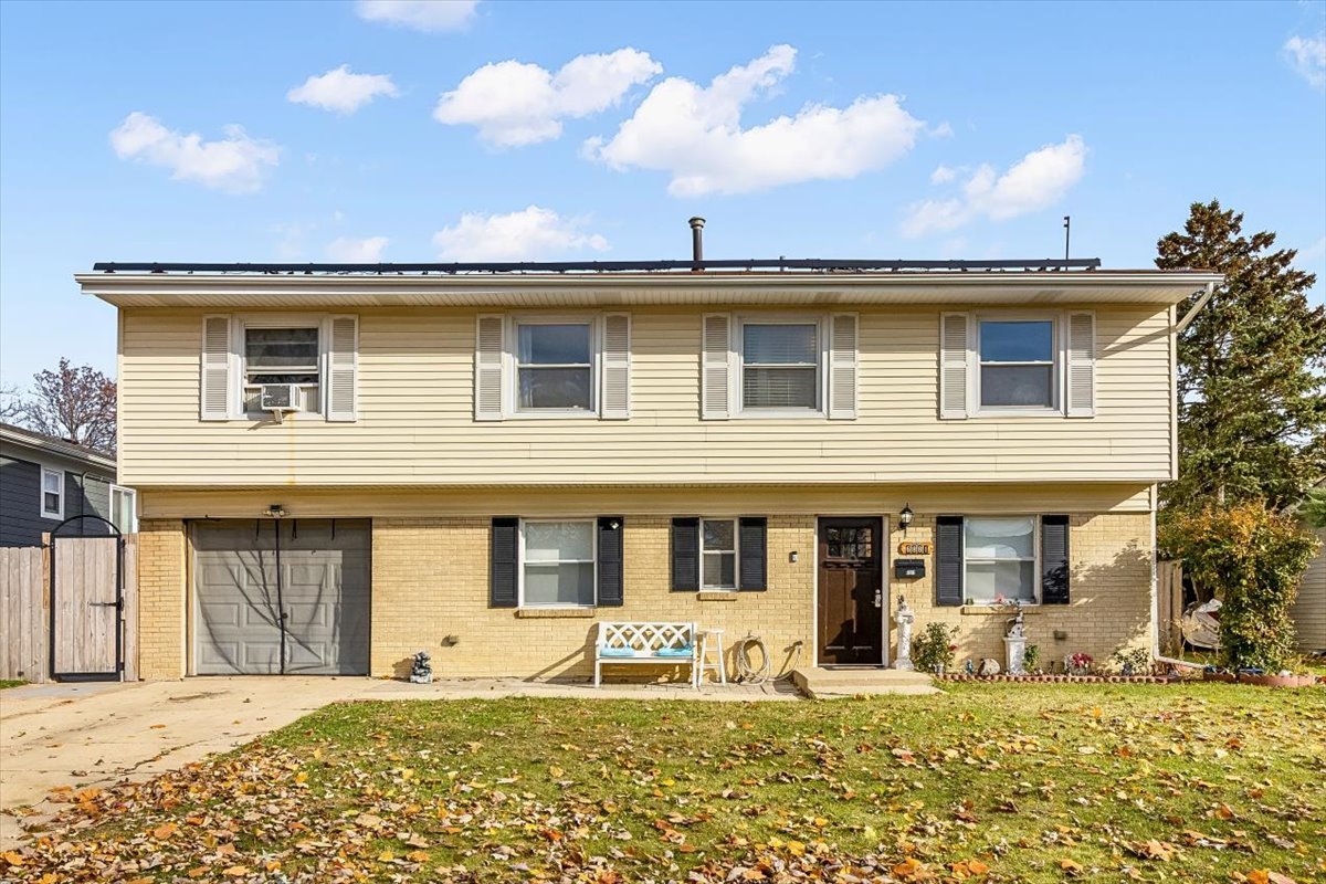 6881 Hickory Street Hanover Park, IL 60133 - Photo 1 of 23 front view of a house with a yard