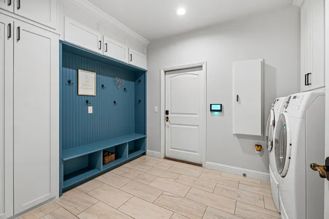 a bathroom with a shower and a glass door