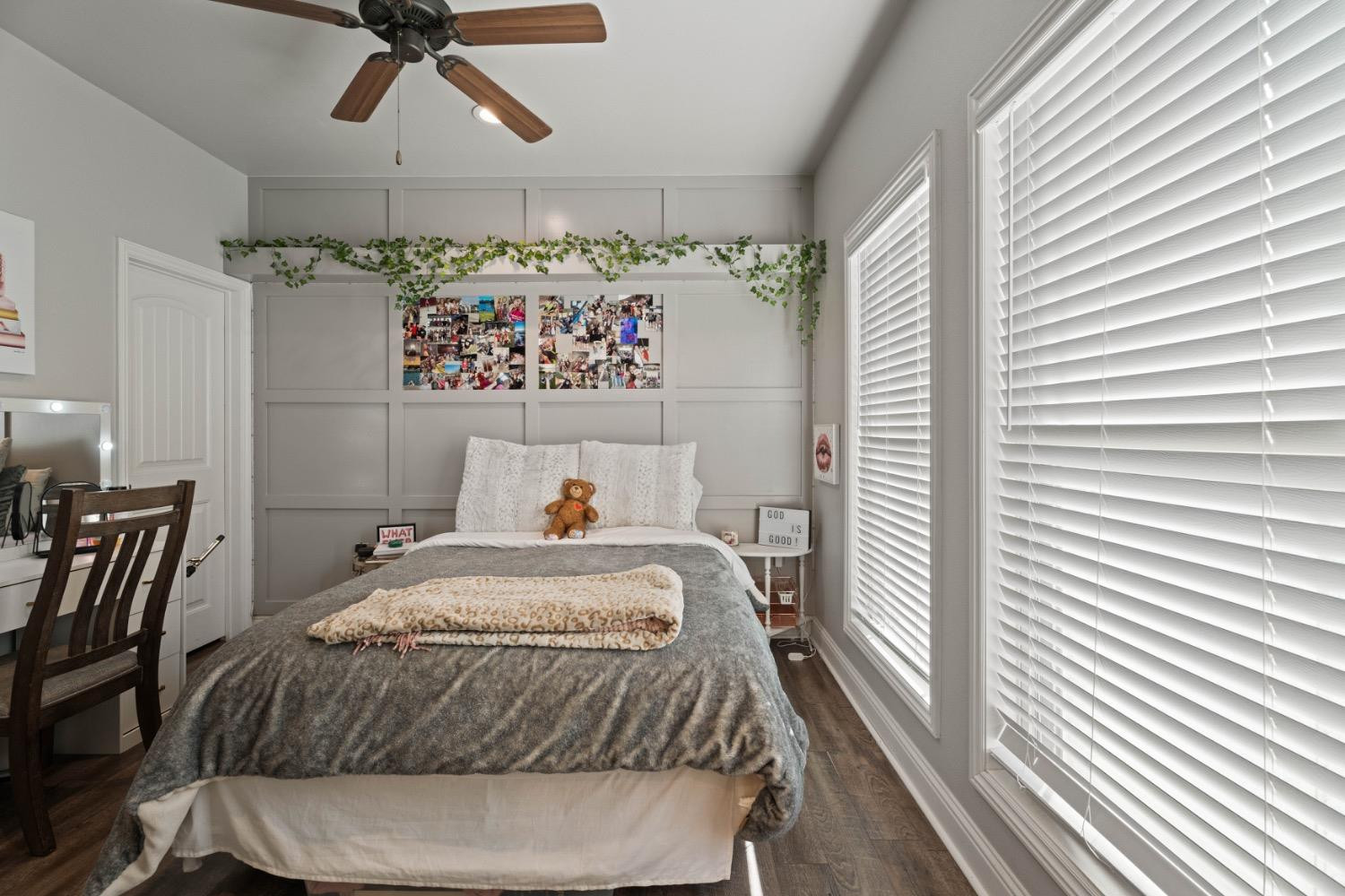 813 Avenue T Shallowater, TX 79363 - Photo 22 of 36 a bedroom with a bed and a chandelier