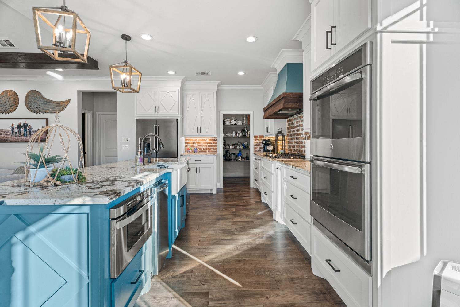 813 Avenue T Shallowater, TX 79363 - Photo 9 of 36 a kitchen with stainless steel appliances granite countertop a refrigerator a stove a sink and a refrigerator