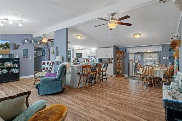 a living room with lots of furniture and a chandelier