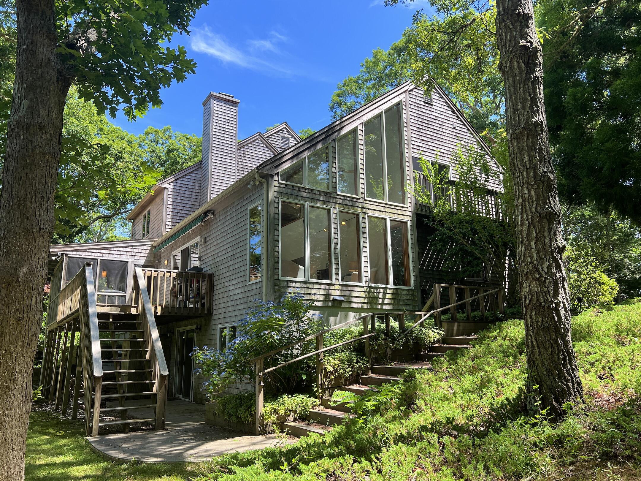 a view of house with yard and green space