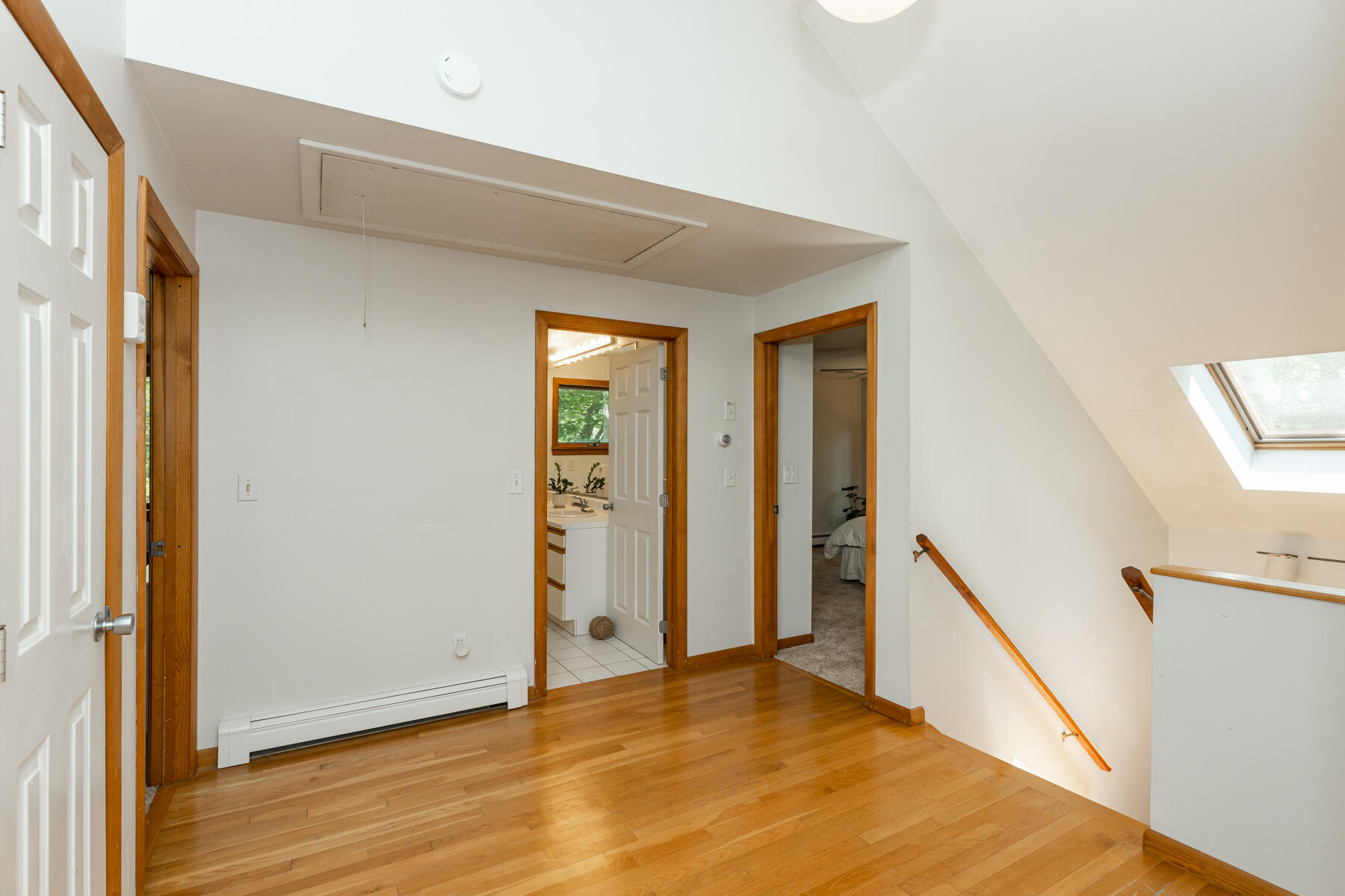 19 Proctor Road Woods Hole, MA 02543 - Photo 19 of 43 a view of an empty room with wooden floor and stairs