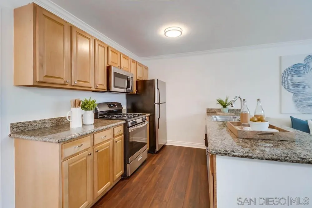 4375 Felton Street, Unit 3 San Diego, CA 92104 - Photo 11 of 27 a kitchen that has a sink and a stove top oven