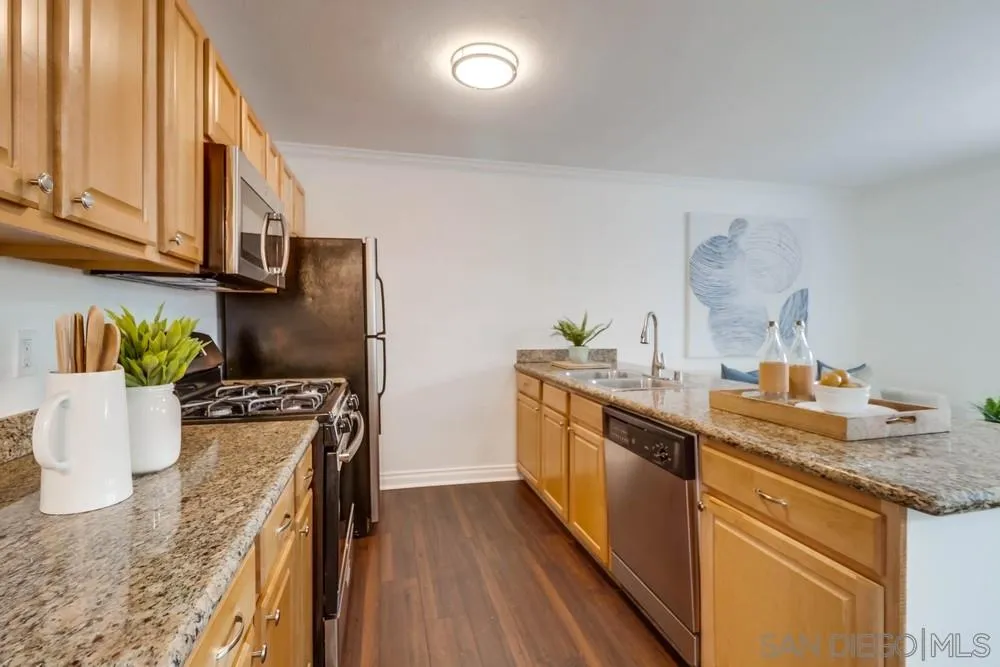 4375 Felton Street, Unit 3 San Diego, CA 92104 - Photo 12 of 27 a kitchen with stainless steel appliances granite countertop a sink stove and refrigerator