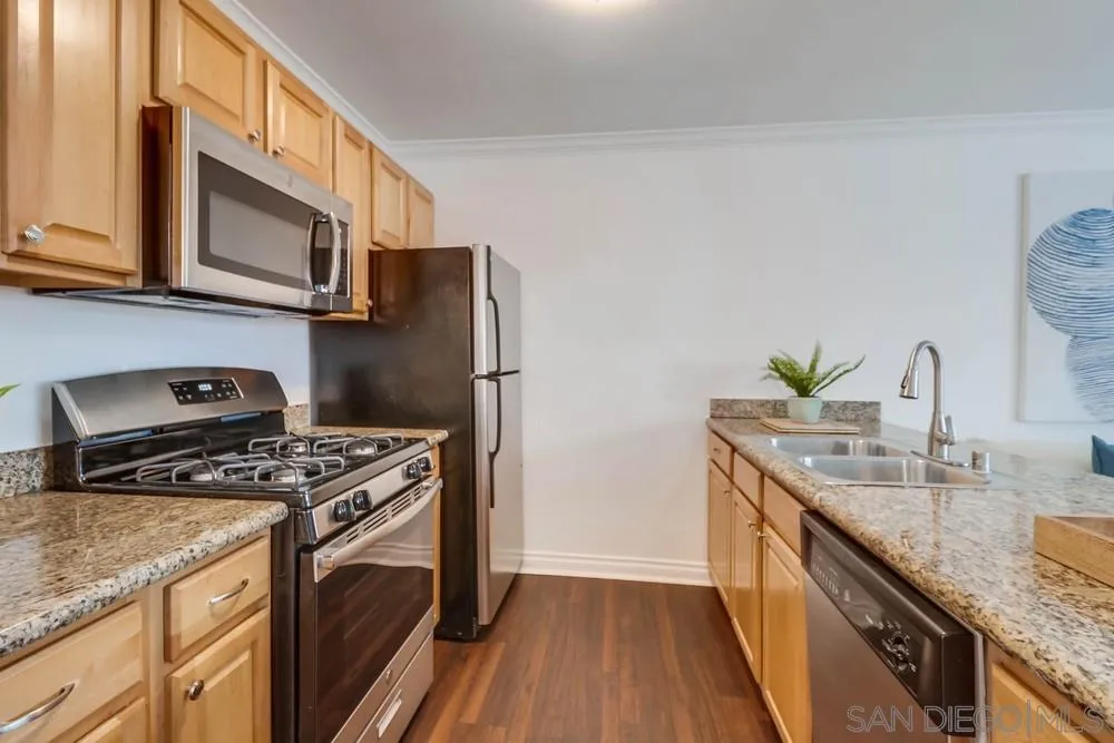 4375 Felton Street, Unit 3 San Diego, CA 92104 - Photo 14 of 27 a kitchen with stainless steel appliances granite countertop a stove a sink and a refrigerator