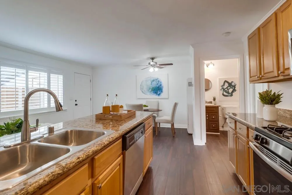 4375 Felton Street, Unit 3 San Diego, CA 92104 - Photo 15 of 27 a kitchen with stainless steel appliances granite countertop a sink stove and cabinets