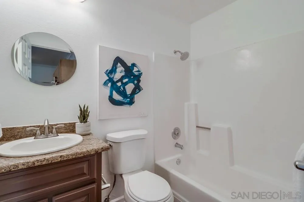 4375 Felton Street, Unit 3 San Diego, CA 92104 - Photo 21 of 27 a bathroom with a granite countertop toilet sink and mirror
