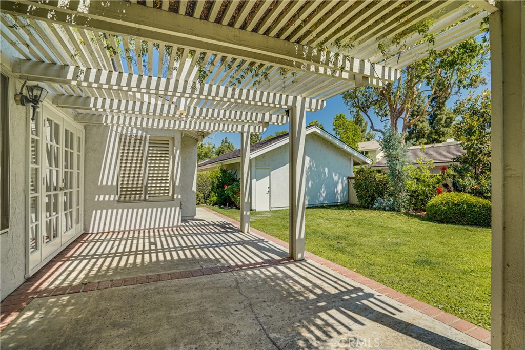 49 East Yale Loop, Unit 26 Irvine, CA 92604 - Photo 43 of 63 a view of a porch with a garden