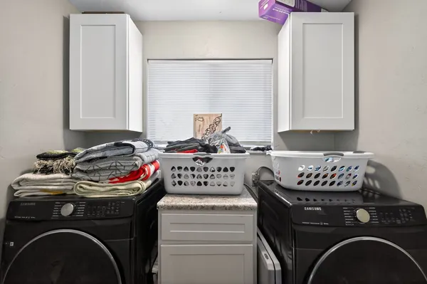 a utility room with dryer and washer