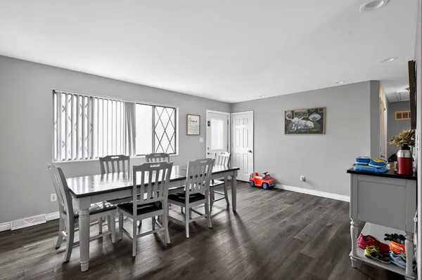 a view of a livingroom with furniture and wooden floor