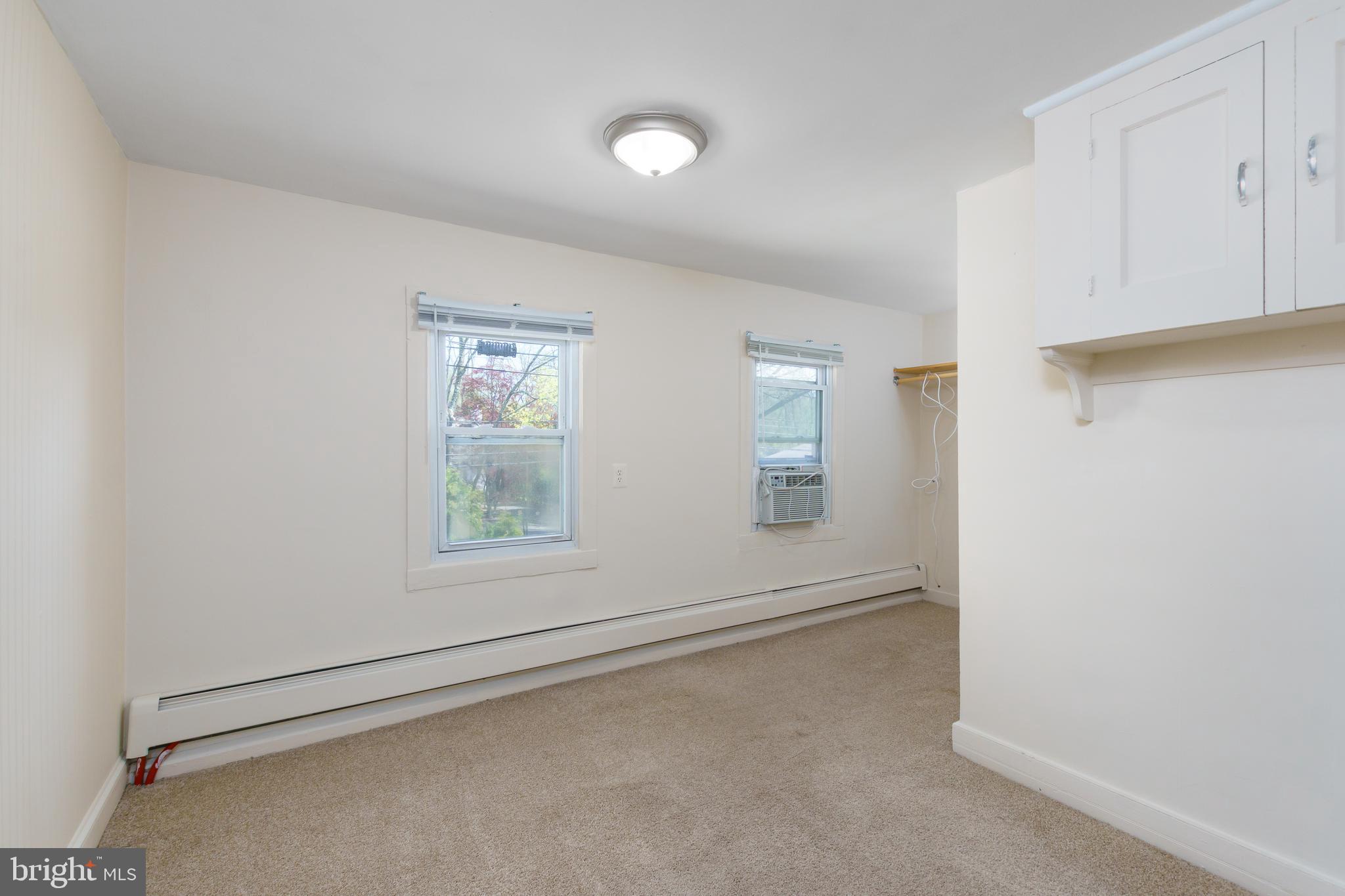 124 Washington Road, Unit 2 Princeton Junction, NJ 08540 - Photo 15 of 18 an empty room with windows