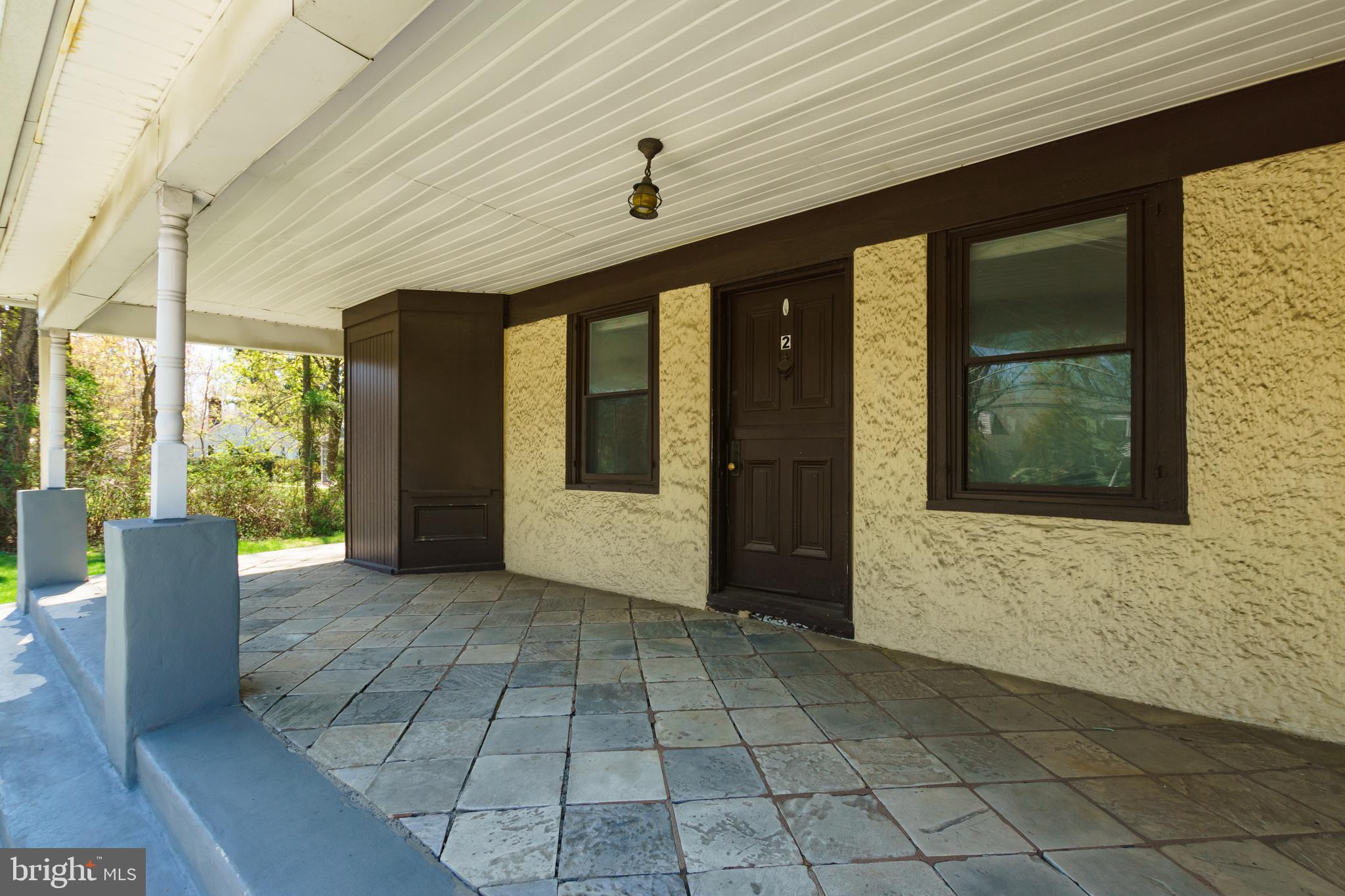 124 Washington Road, Unit 2 Princeton Junction, NJ 08540 - Photo 2 of 18 a front view of a house with a large window