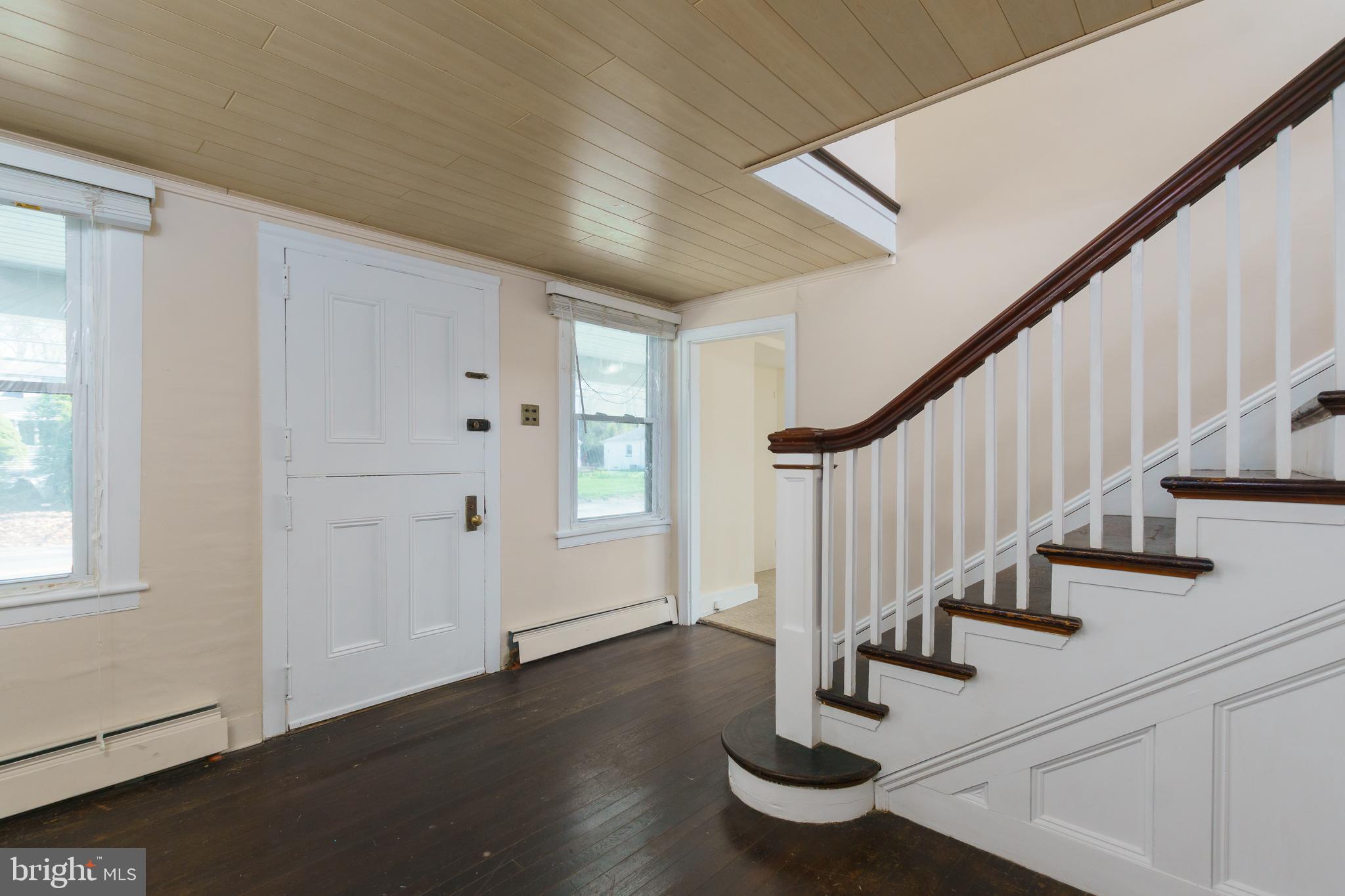 124 Washington Road, Unit 2 Princeton Junction, NJ 08540 - Photo 3 of 18 a view of entryway with wooden floor and stairs