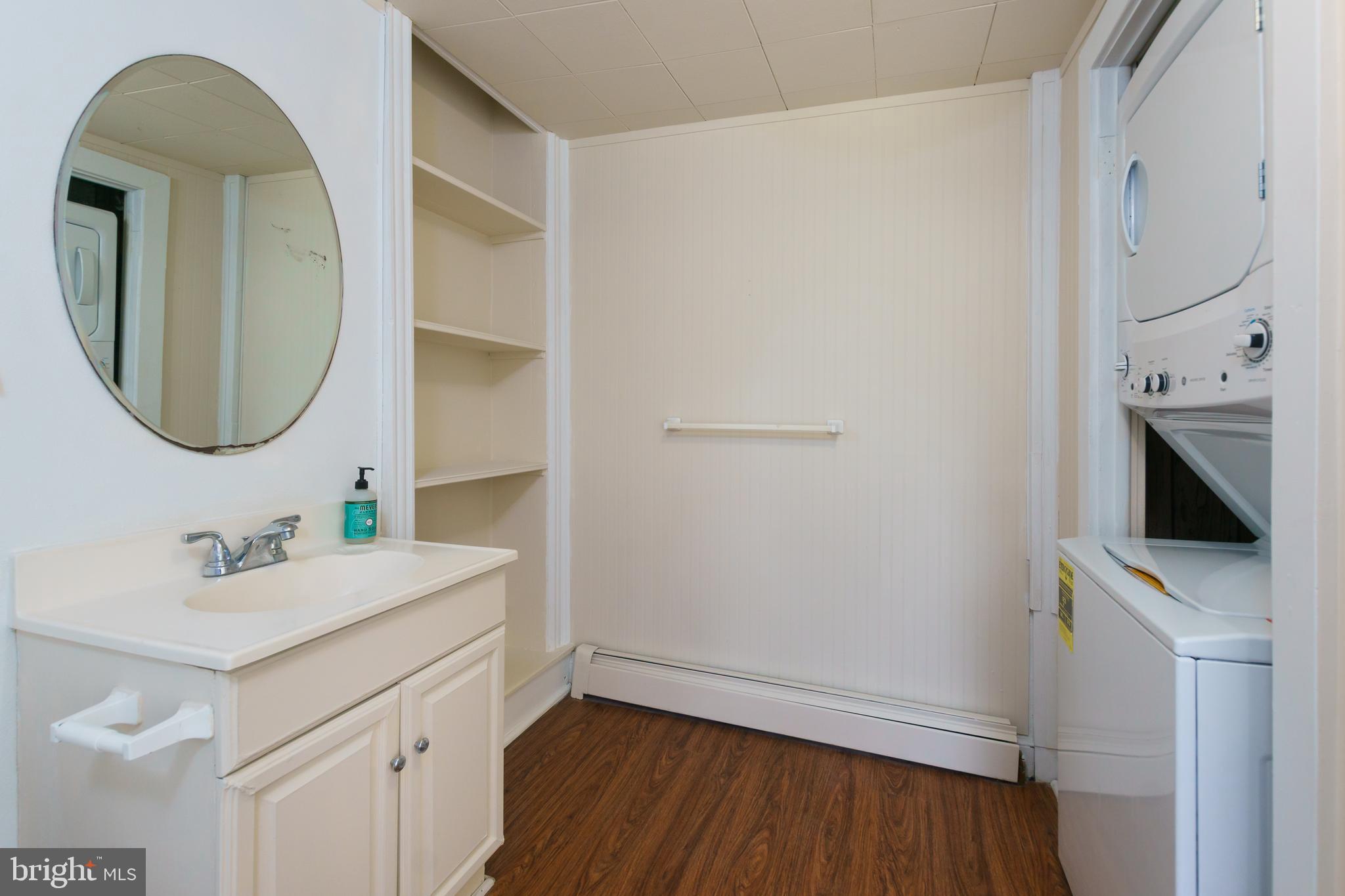 124 Washington Road, Unit 2 Princeton Junction, NJ 08540 - Photo 9 of 18 a bathroom with a sink a toilet and a mirror