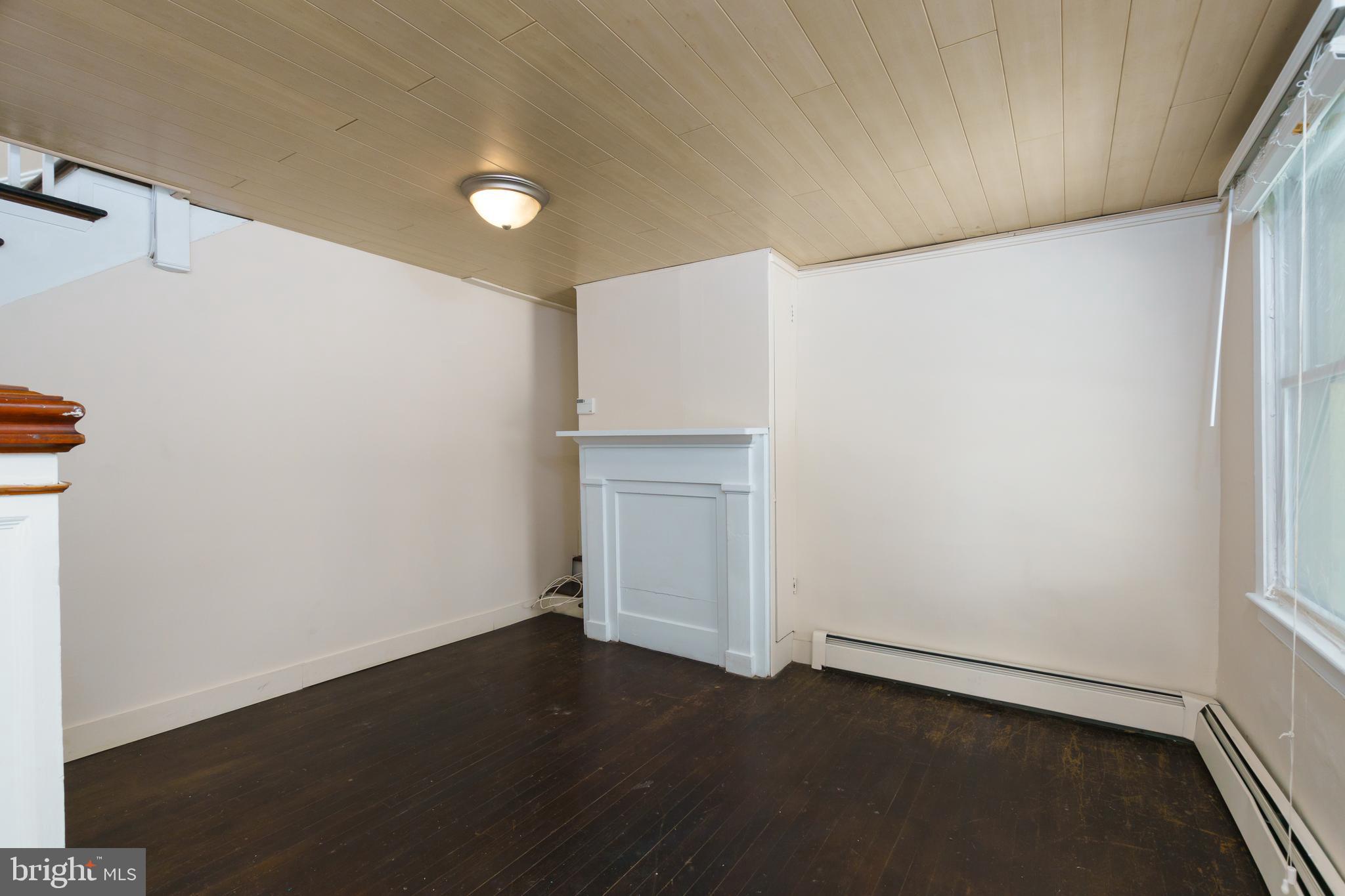 124 Washington Road, Unit 2 Princeton Junction, NJ 08540 - Photo 10 of 18 an empty room with wooden floor and windows