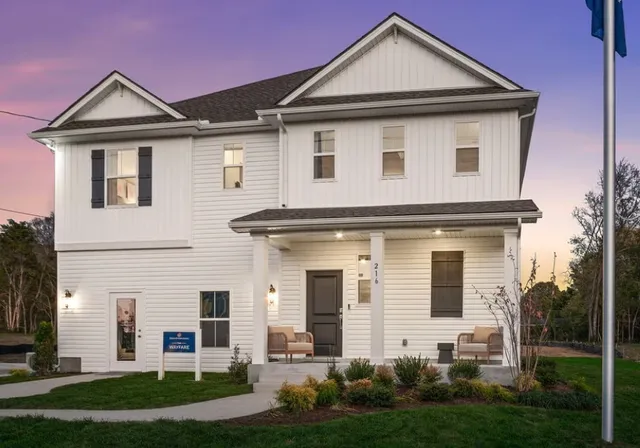 a front view of a house with a yard