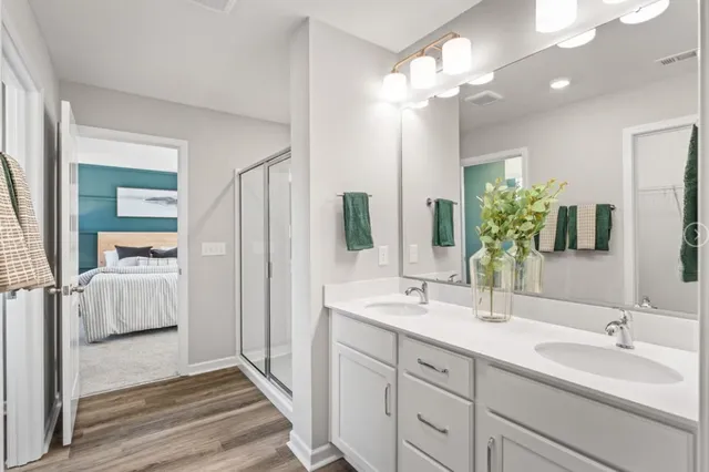a bathroom with a double vanity sink and a mirror