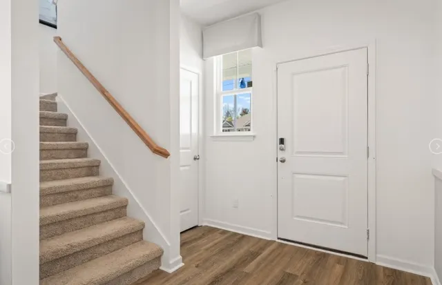 a view of entryway with wooden floor