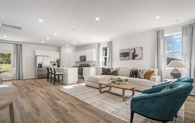 a living room with furniture and a table