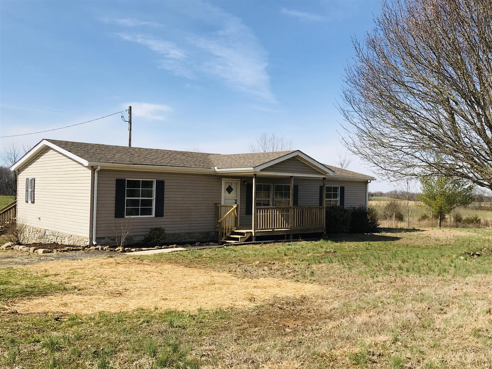 145 Absher Road Portland, TN 37148 - Photo 1 of 22 a front view of a house with yard