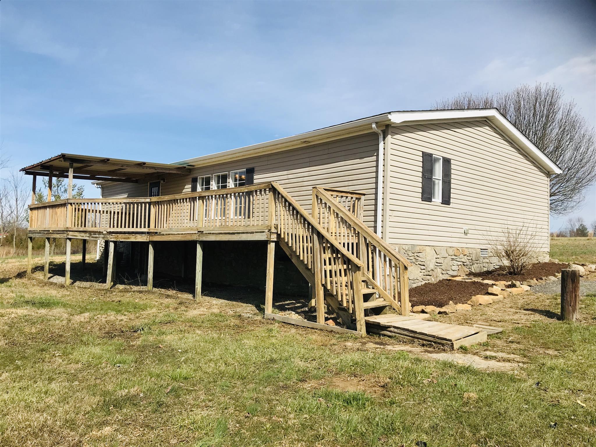 145 Absher Road Portland, TN 37148 - Photo 18 of 22 a view of a house with a backyard