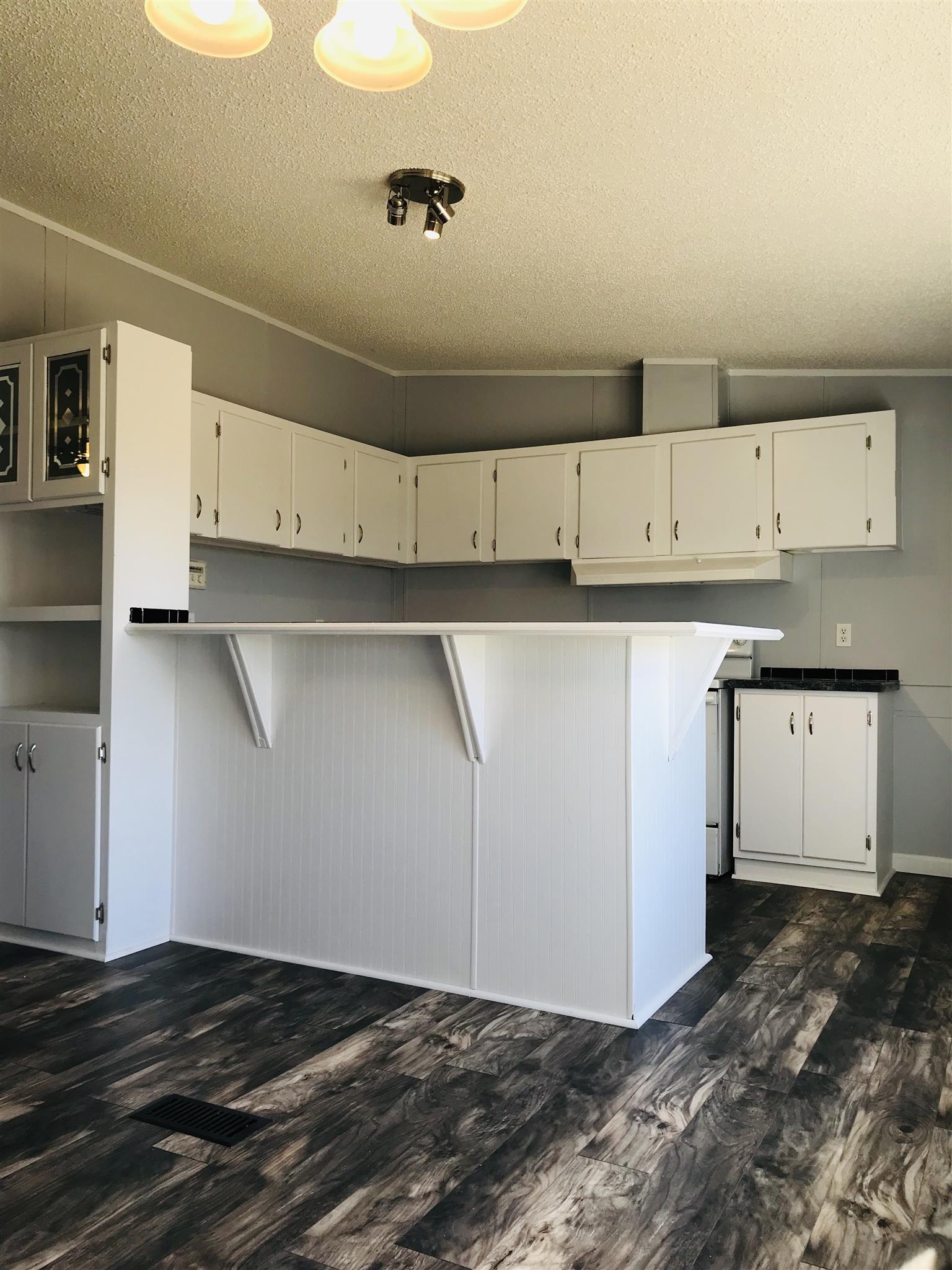 145 Absher Road Portland, TN 37148 - Photo 4 of 22 a view of cabinets and wooden floor