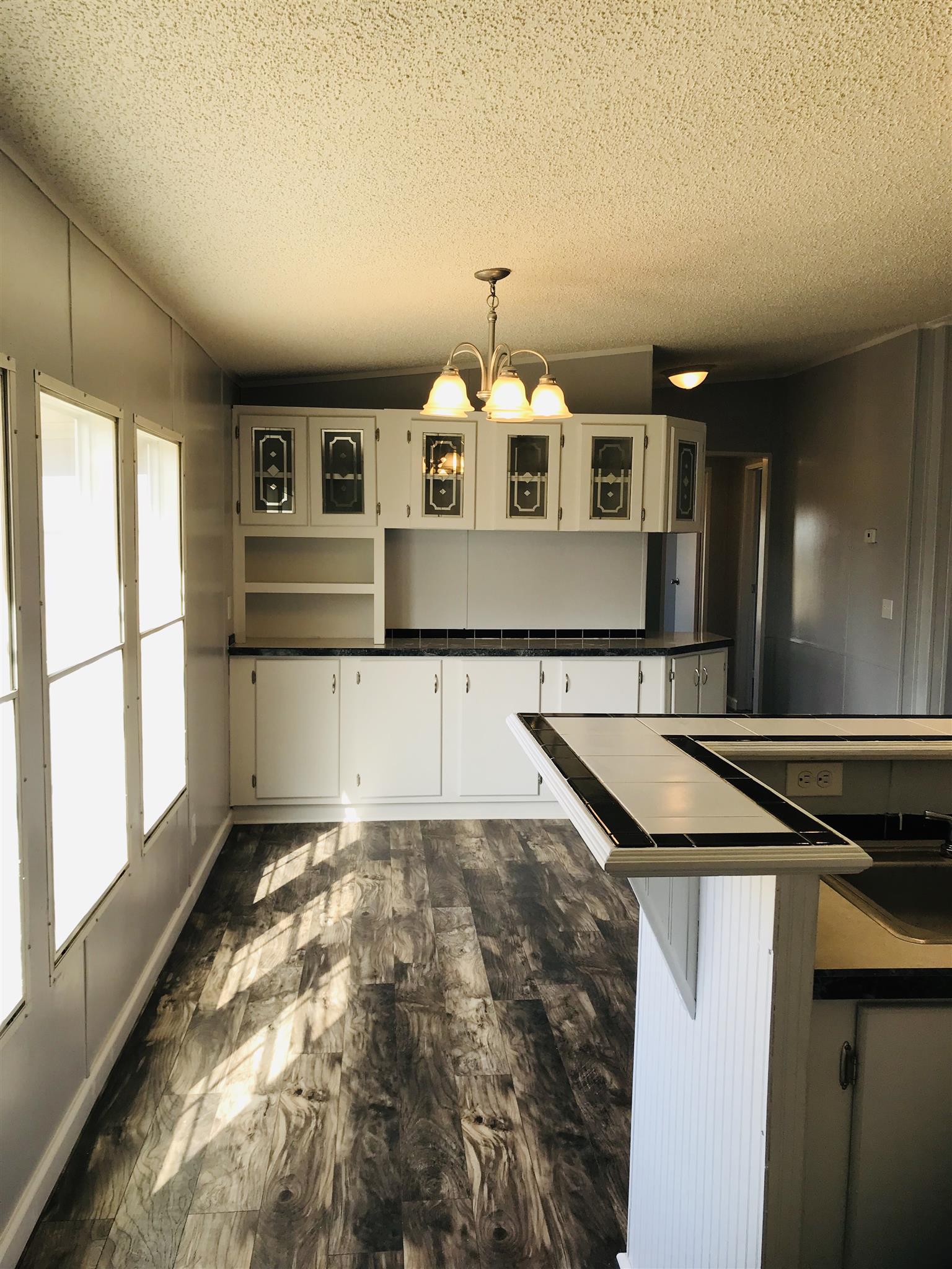 145 Absher Road Portland, TN 37148 - Photo 6 of 22 a kitchen that has a sink and a stove