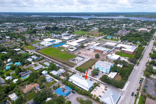 an aerial view of residential houses with outdoor space