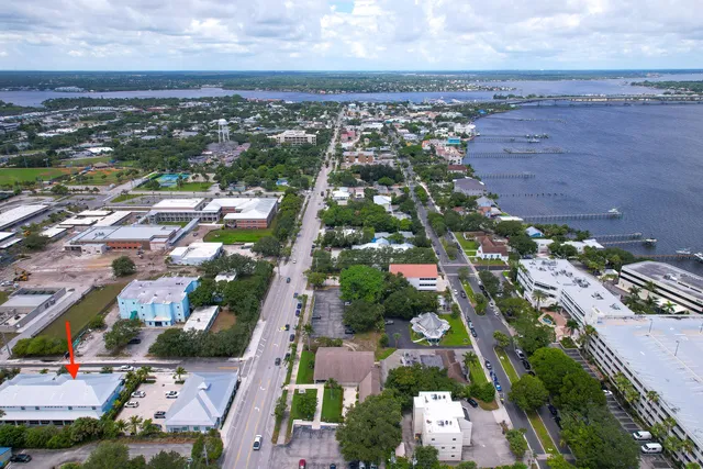 an aerial view of a house with yard and outdoor seating