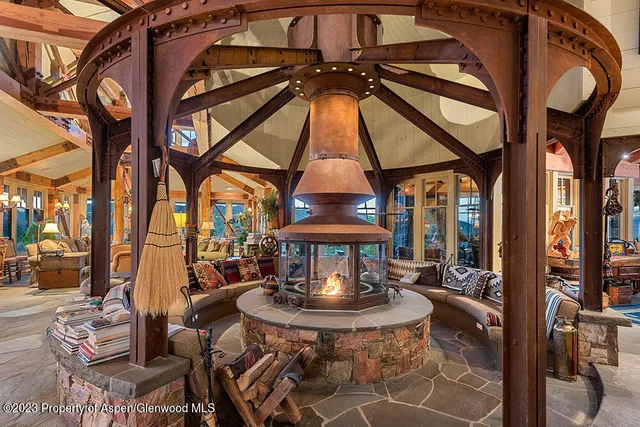 a view of a chair and tables in the patio