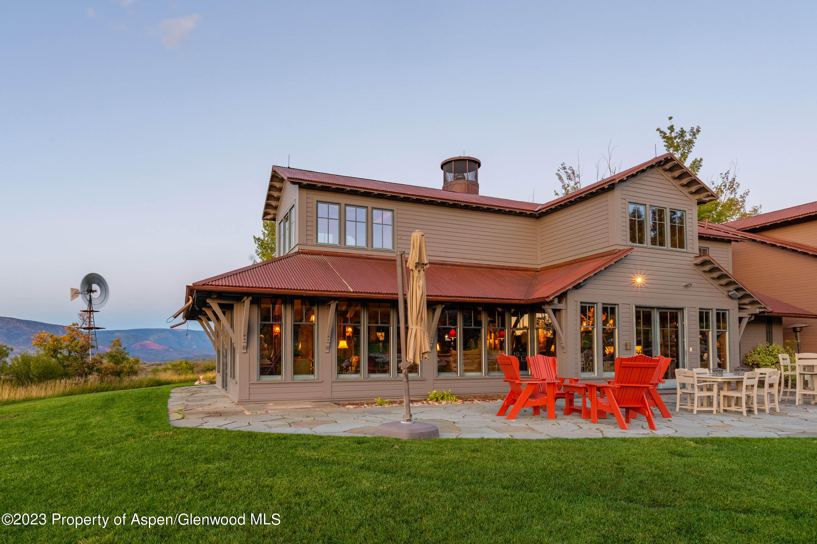 777 Old Herron Road Basalt, CO 81621 - Photo 32 of 43 a front view of a house with a yard table and chairs