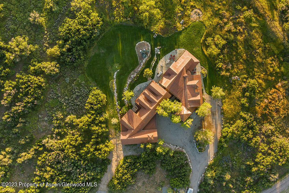 777 Old Herron Road Basalt, CO 81621 - Photo 43 of 43 an aerial view of a house with a yard and garden