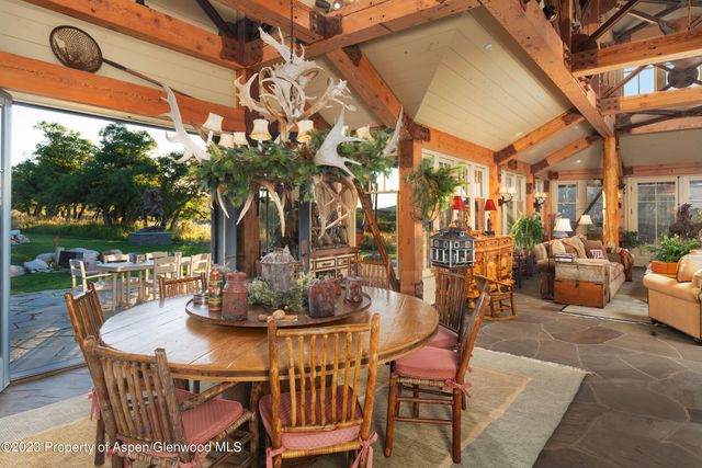 a view of a patio with a table and chairs