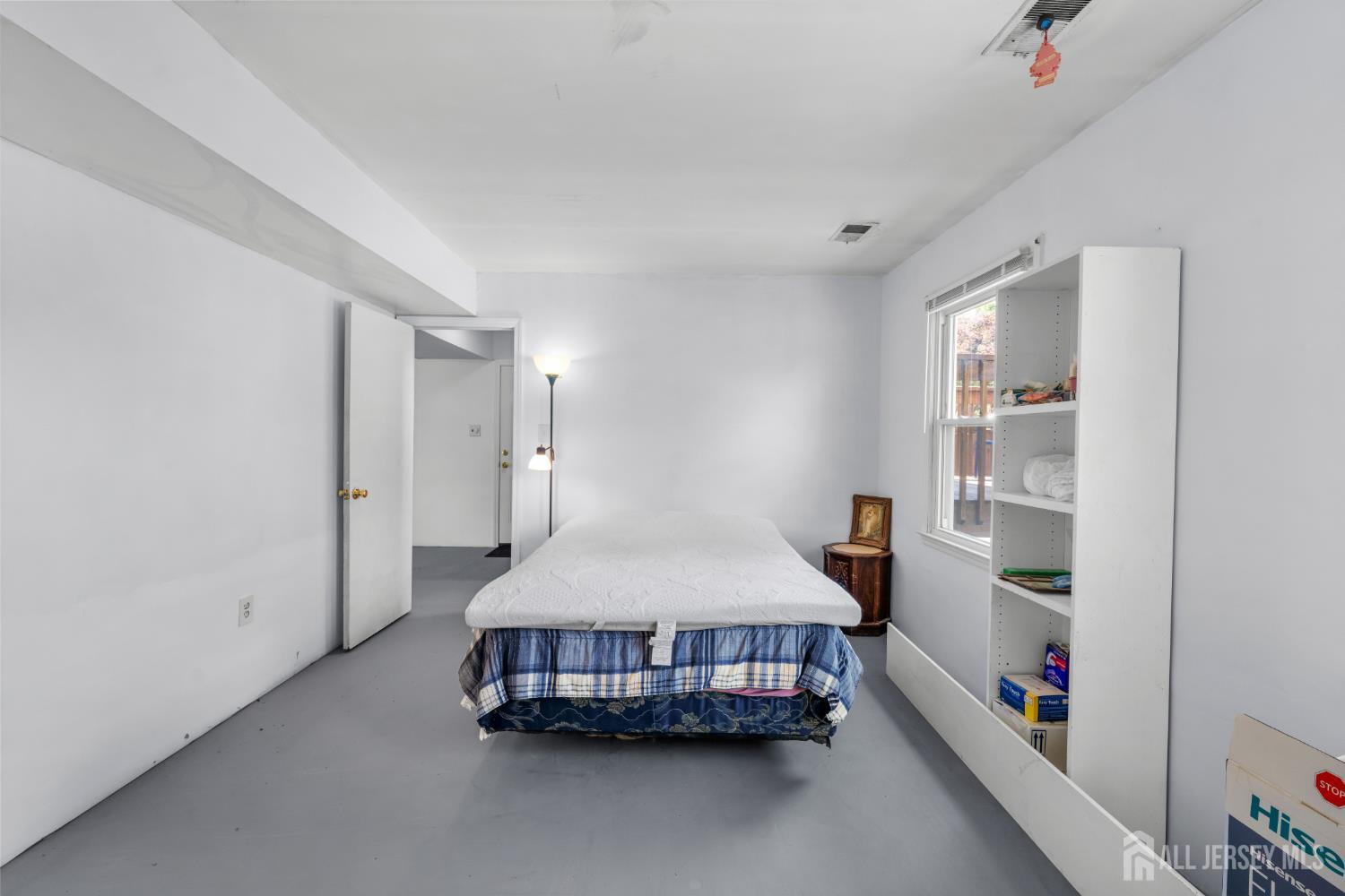 245 4th Street Dunellen, NJ 08812 - Photo 15 of 27 a bedroom with a bed and a window