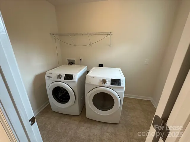 a bathroom with a double vanity sink mirror and shower