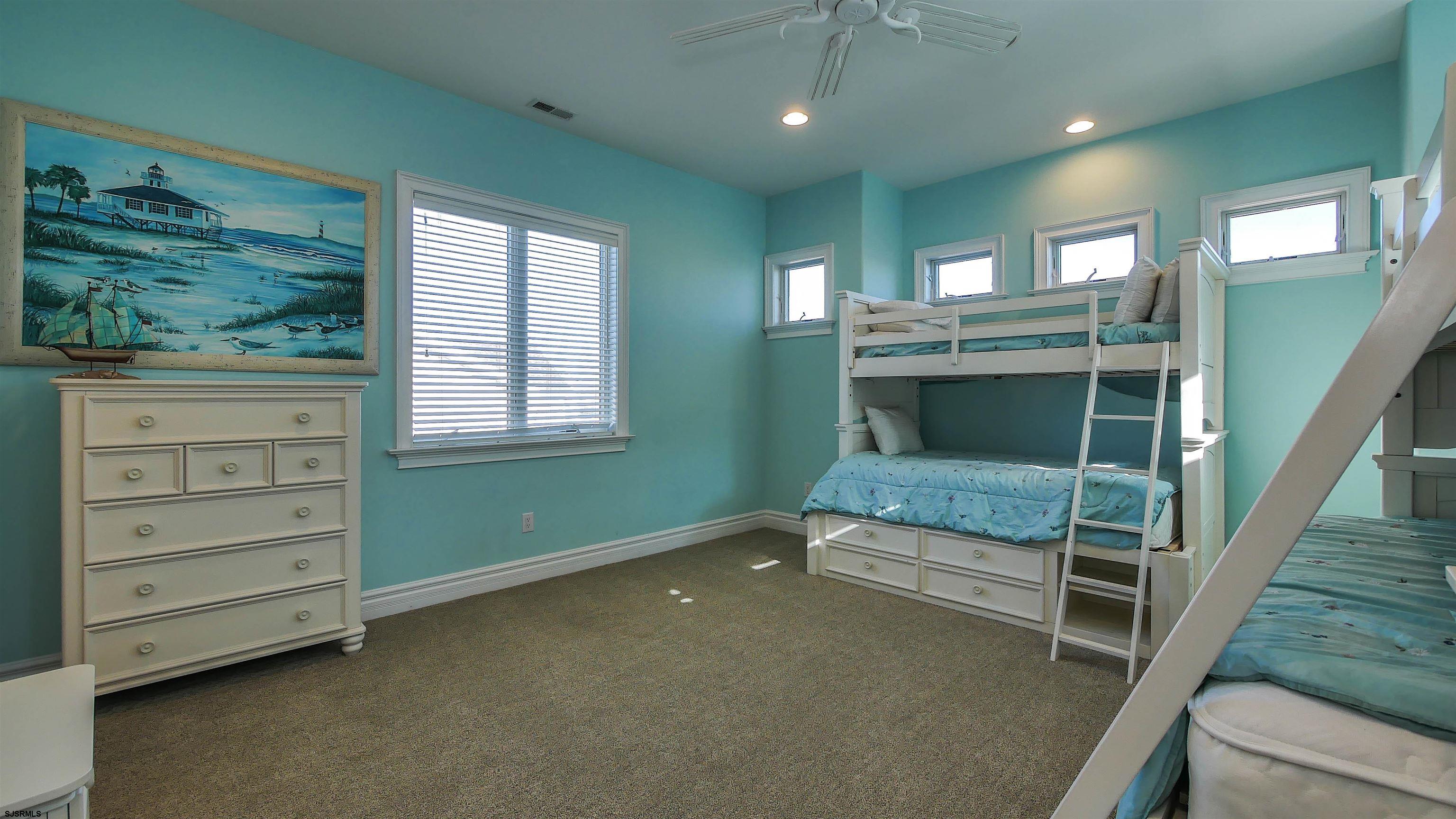 530 West Shore Drive, Unit DIRECT BAYFRONT Brigantine, NJ 08203 - Photo 32 of 63 a bedroom with furniture and a window