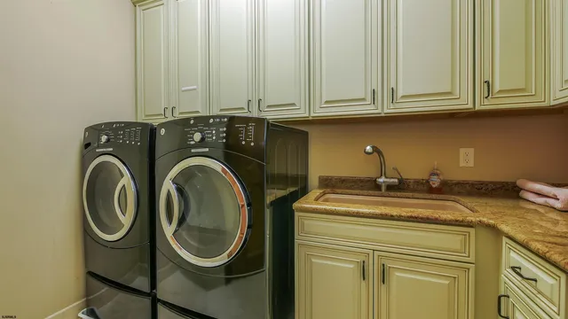 a spacious bedroom with a large bed and a large window