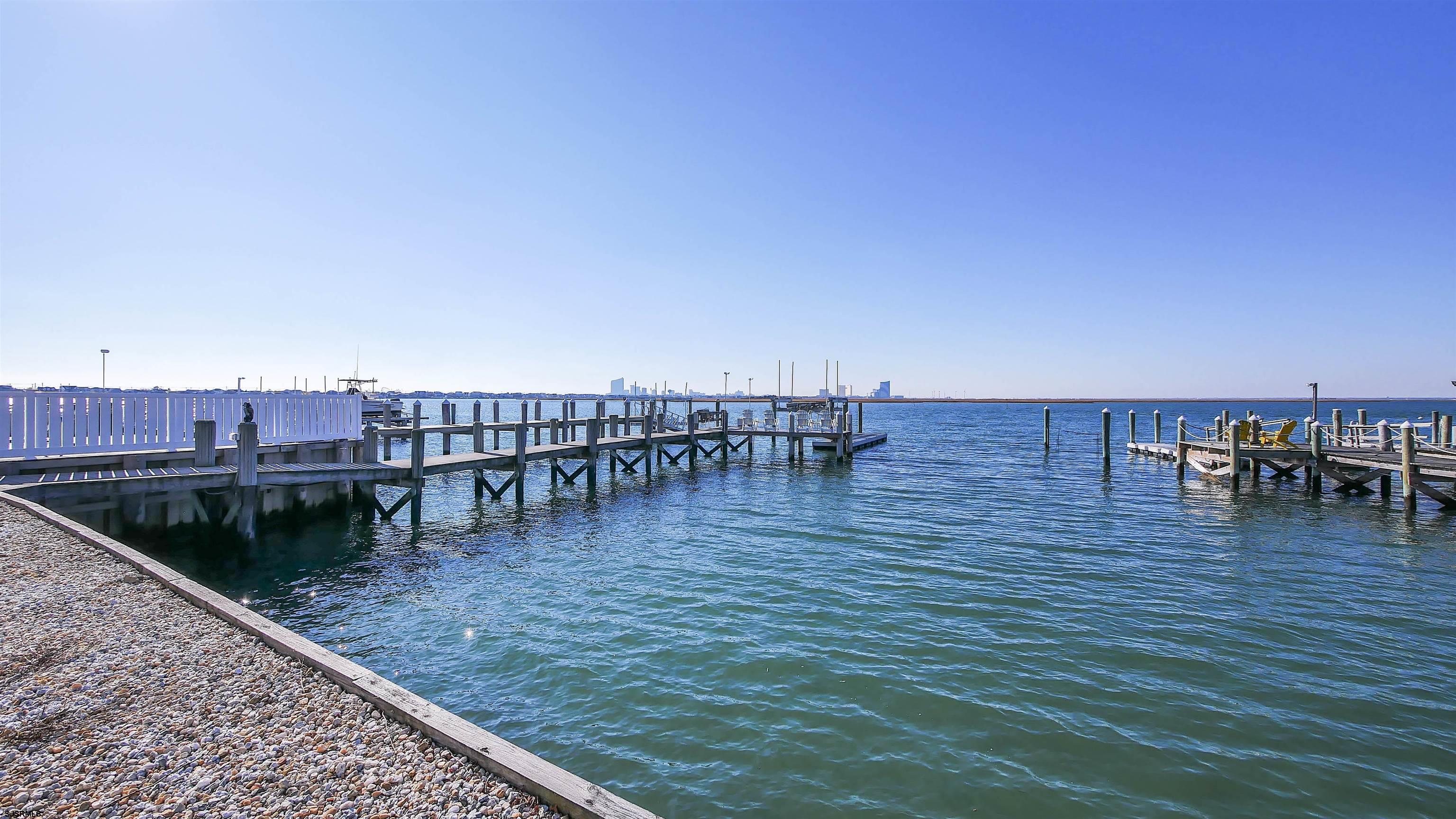 530 West Shore Drive, Unit DIRECT BAYFRONT Brigantine, NJ 08203 - Photo 54 of 63 a view of a terrace with chairs