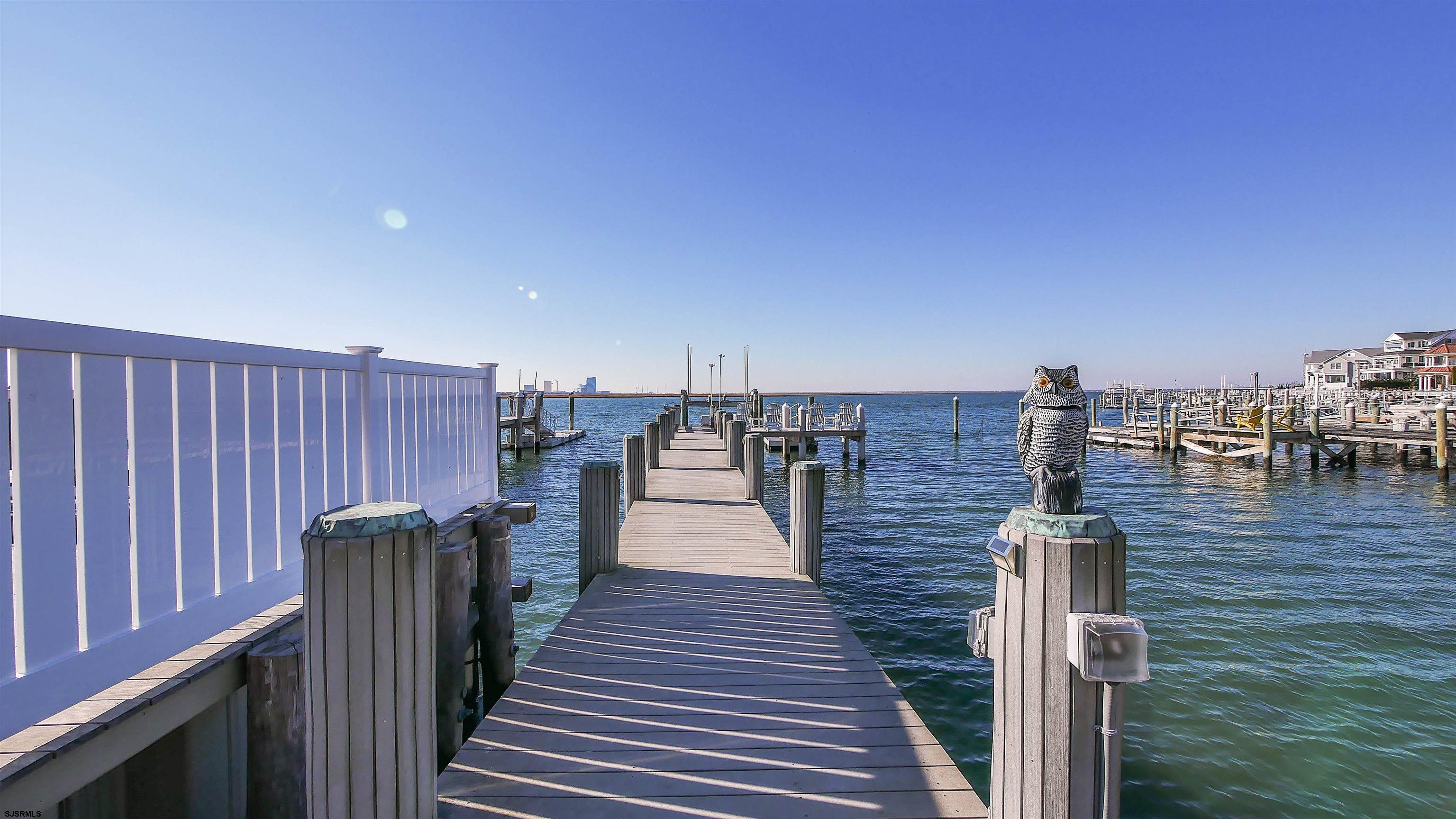 530 West Shore Drive, Unit DIRECT BAYFRONT Brigantine, NJ 08203 - Photo 56 of 63 a view of a balcony with wooden floor