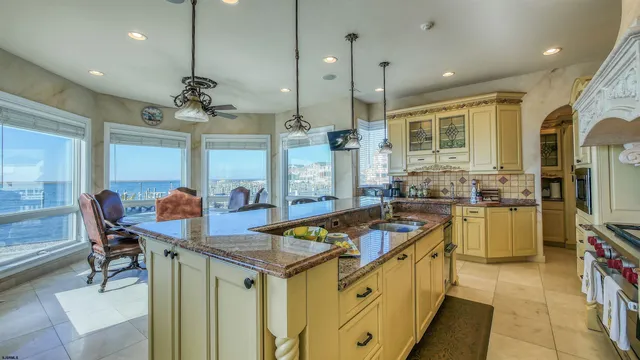 a dining room with furniture a chandelier and a rug