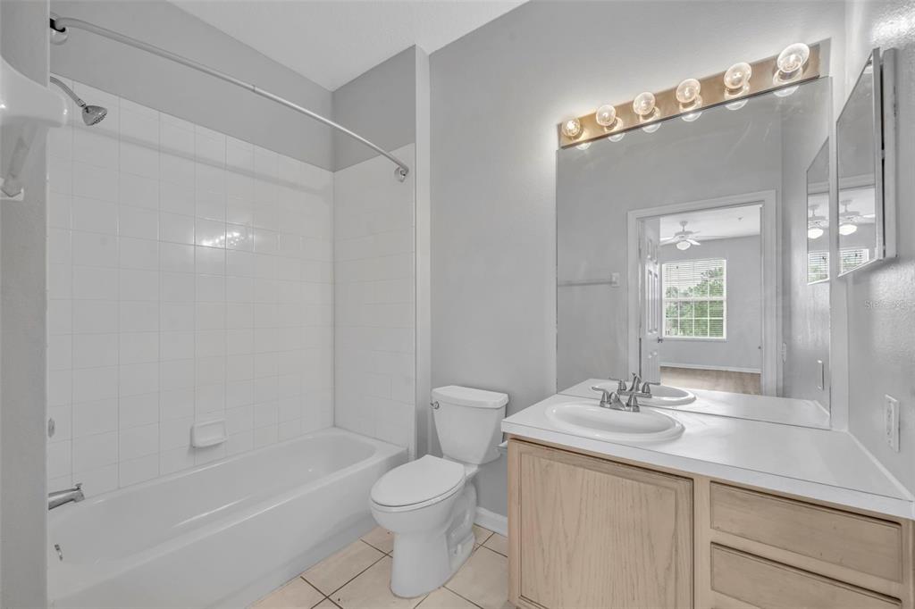 582 Brantley Terrace Way, Unit 304 Altamonte Springs, FL 32714 - Photo 23 of 30 a bathroom with a sink a toilet and shower