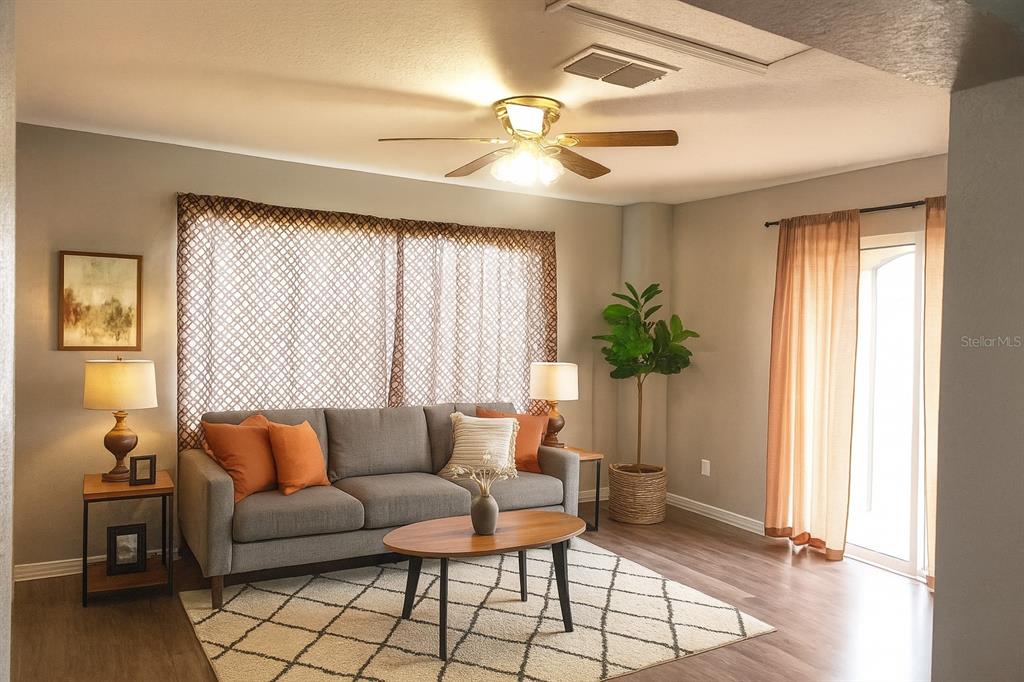 6070 Southwest 99th Place Ocala, FL 34476 - Photo 4 of 19 a living room with furniture and a window