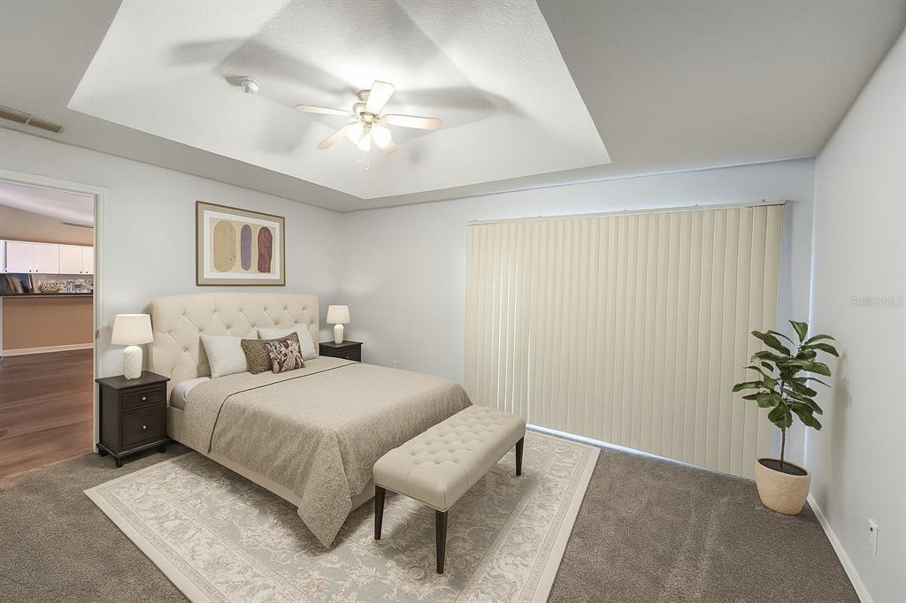 6070 Southwest 99th Place Ocala, FL 34476 - Photo 7 of 19 a bedroom with a bed and a potted plant