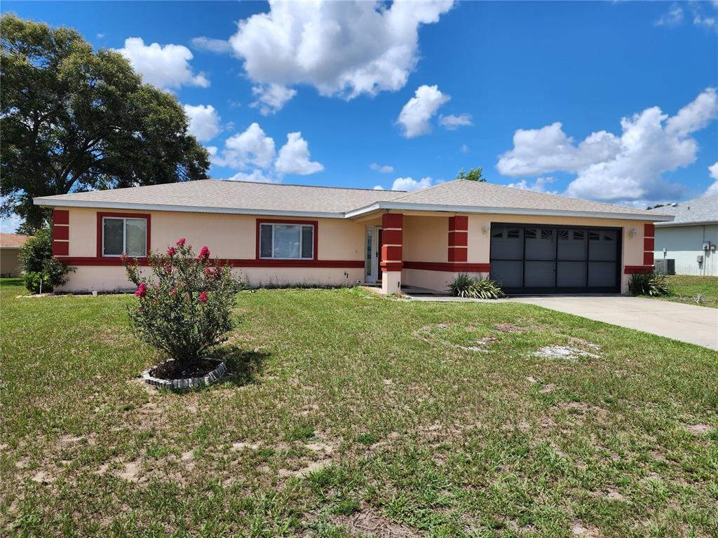 6070 Southwest 99th Place Ocala, FL 34476 - Photo 10 of 19 a house view with a garden space