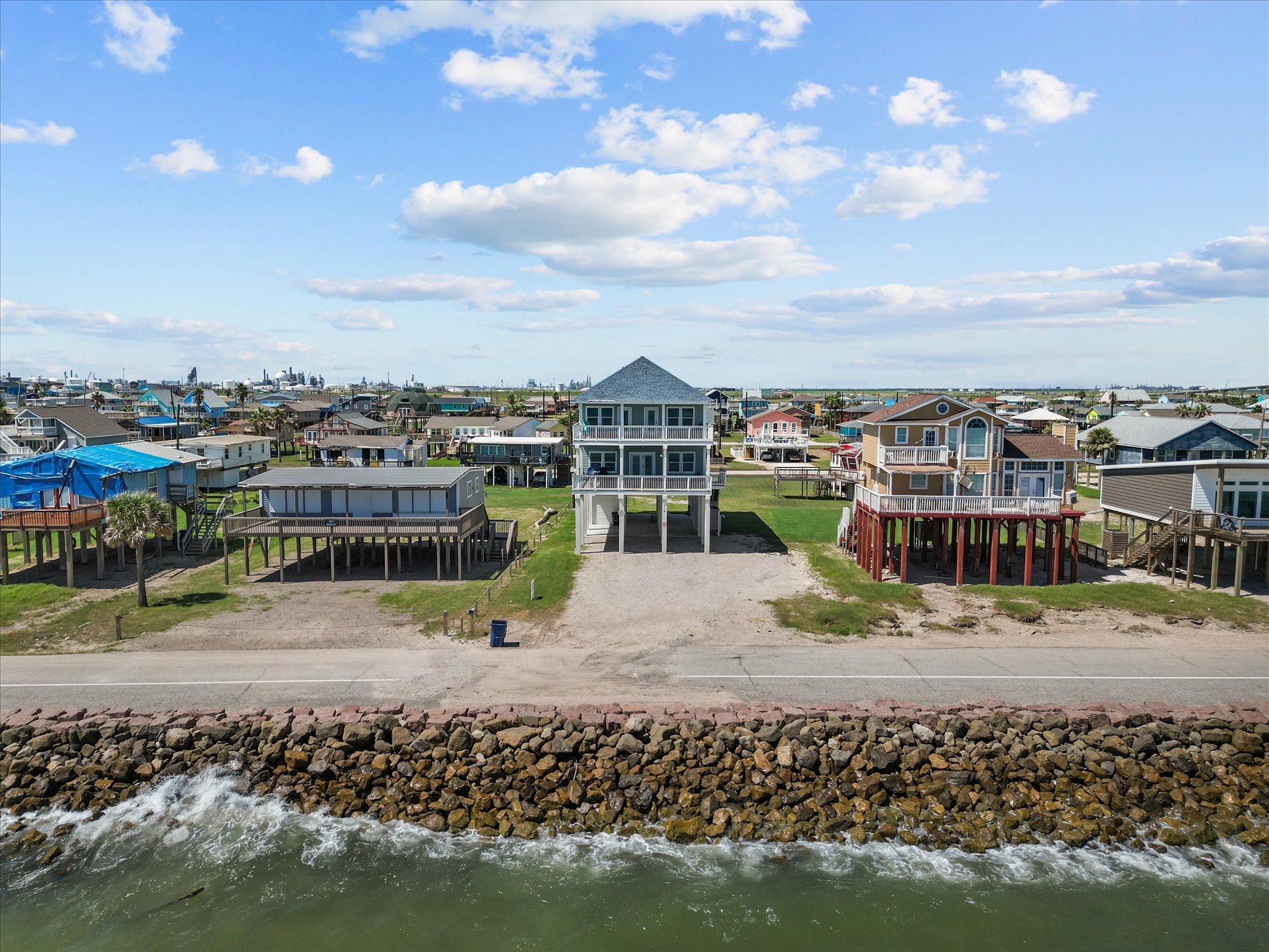 718 Beach Drive Surfside Beach, TX 77541 - Photo 6 of 49 Beachfront coastal home with breathtaking ocean views, nestled in a charming and tranquil neighborhood. Perfect for a serene seaside lifestyle.