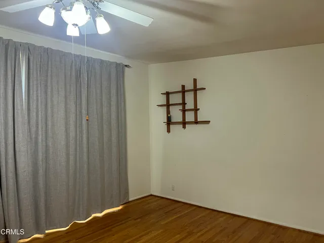 a view of a livingroom with wooden floor