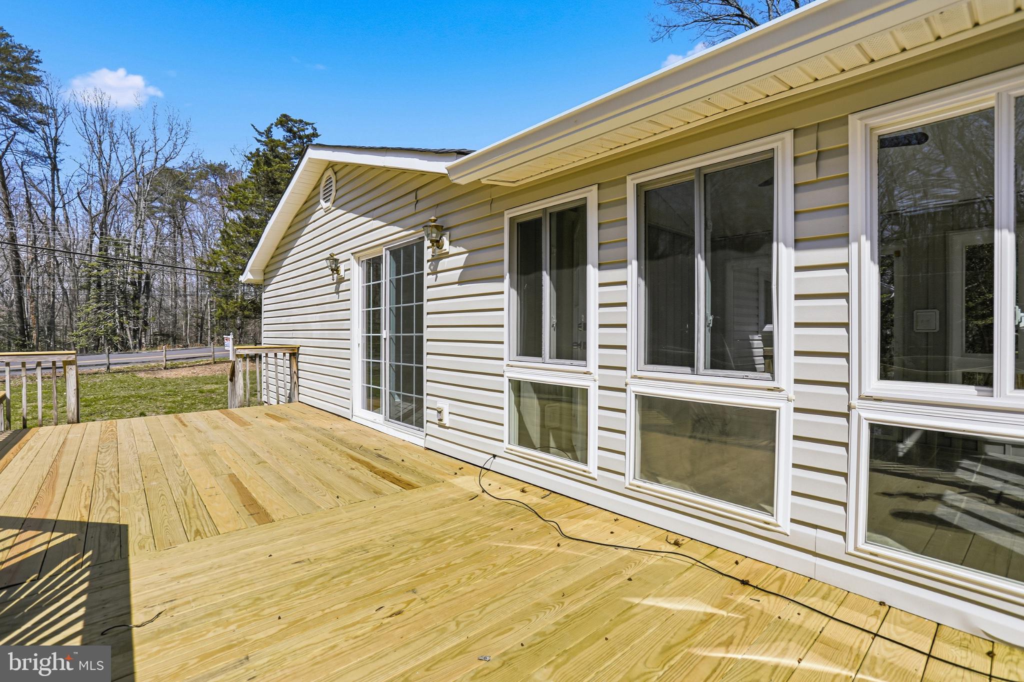 7012 Stanley Road King George, VA 22485 - Photo 27 of 37 Sunny deck with serene surroundings.